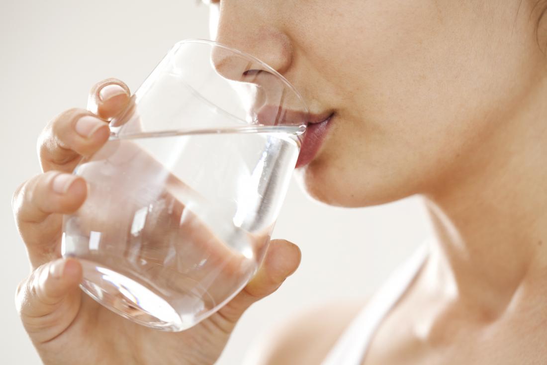 woman-drinking-water-from-a-glass-1690271284193-16902712842691611291085.jpg