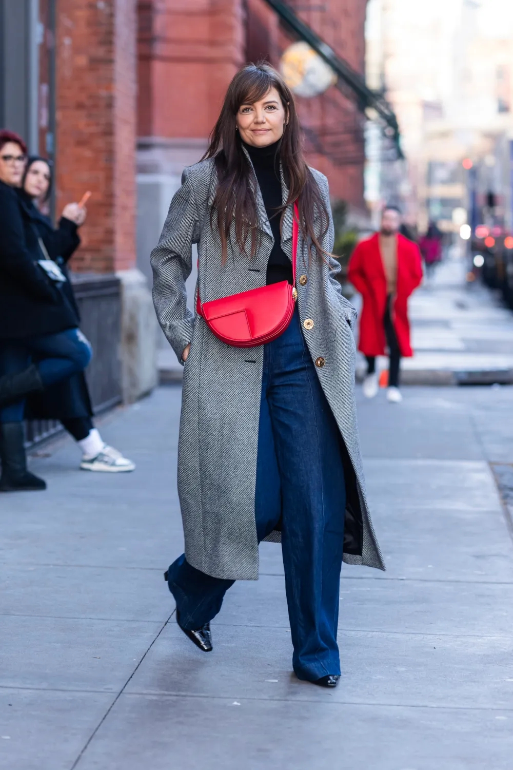 katie-holmes-adds-a-pop-of-festive-red-to-a-neutral-winter-outfit-feature-1708167644039797039784.jpg